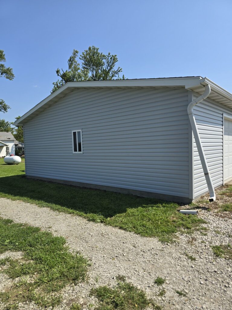 Re-sided garage wall with new gutter and downspout in Villisca, Iowa