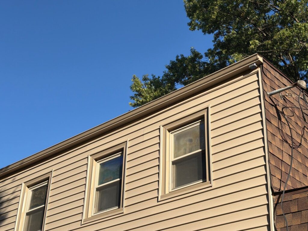 New siding and clay-colored window trim on an Omaha home