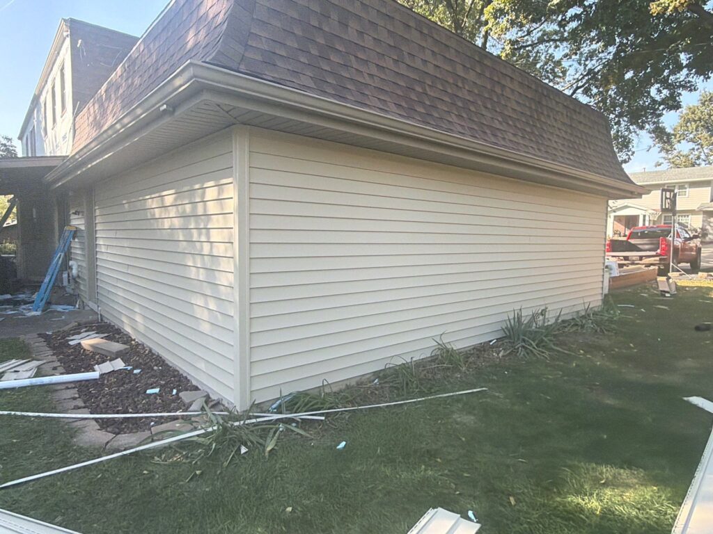 Finished vinyl siding wall and roof edge on a West Omaha home