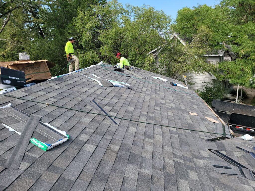 Goodlife Exteriors crew installing Malarkey Vista AR shingles on a La Vista, NE home