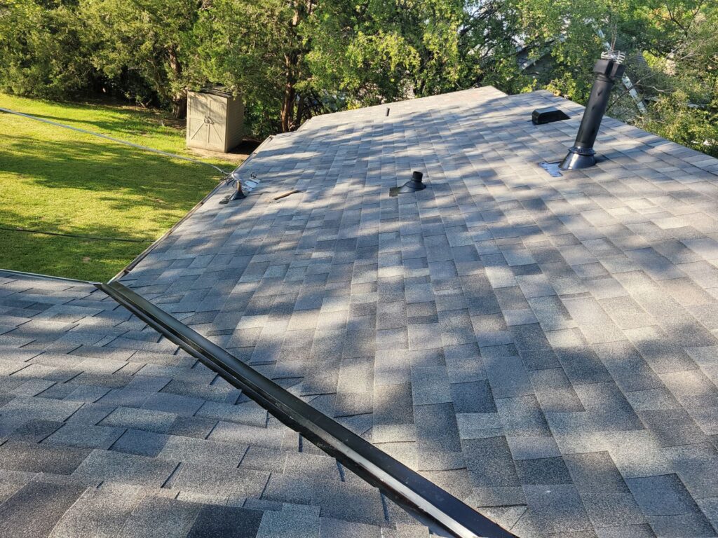 New black W-style valley metal on a Malarkey Storm Grey roof in La Vista, NE